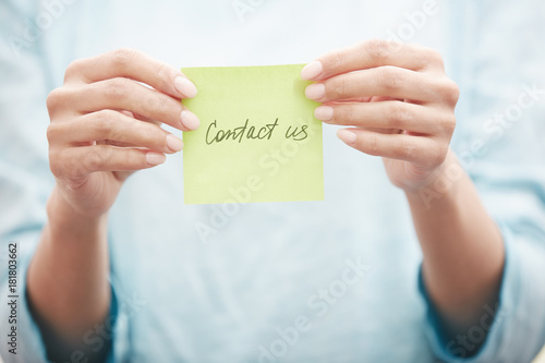 Sticky note with Contact us text