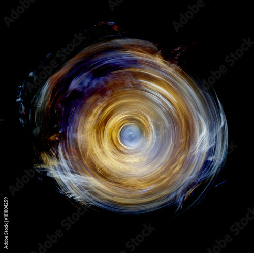 Yellow spinning wheel vortex of light photo