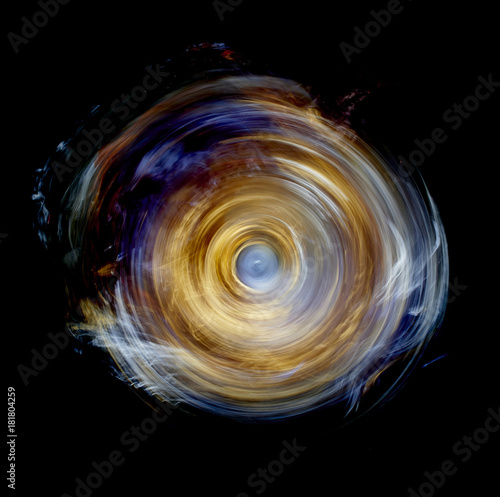 Yellow spinning wheel vortex of light