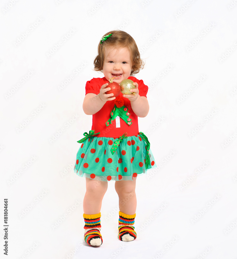 toddler baby in a christmas costume. New Year costume of emotion toddler baby in a christmas costume. New Year costume of emotion