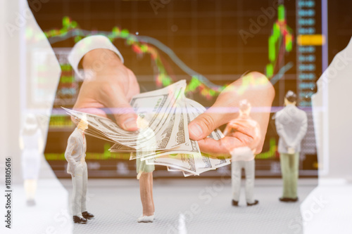 double exposure. Businessman are counting pile money hundread dollas banknotes and small figures businessmen stand and look at Stock Exchange Board Background. photo