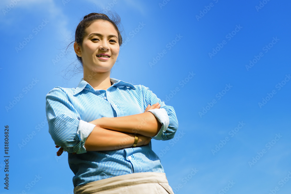 Portrait of a business woman with blue sky Portrait of a business woman with blue sky