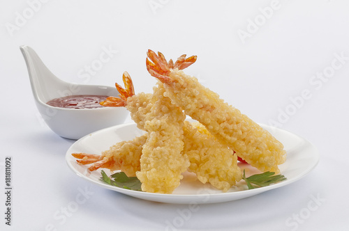 Tempura Jumbo Shrimps with salad and salsa dip on white plate and white background