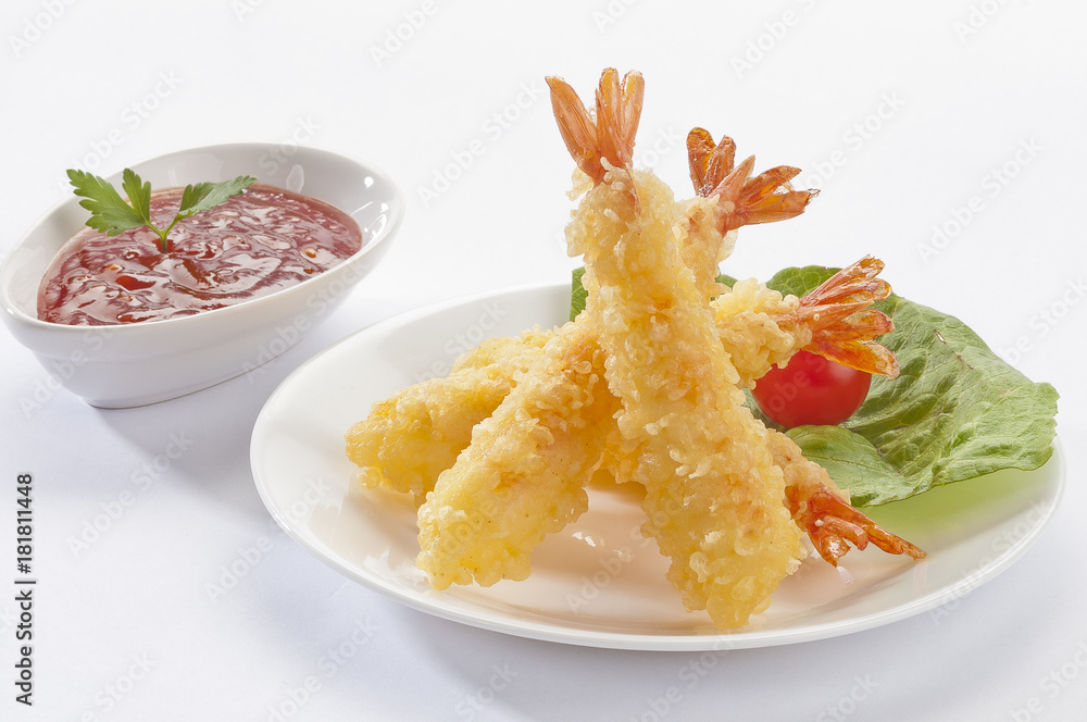 Tempura Jumbo Shrimps with salad and salsa dip on white plate and white background Tempura Jumbo Shrimps with salad and salsa dip on white plate and white background