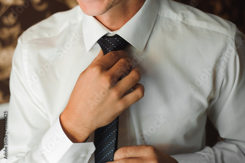 businessman correcting tie fashion
