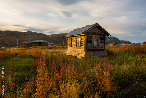 Old wooden house at sunset in Teriberka. Russia