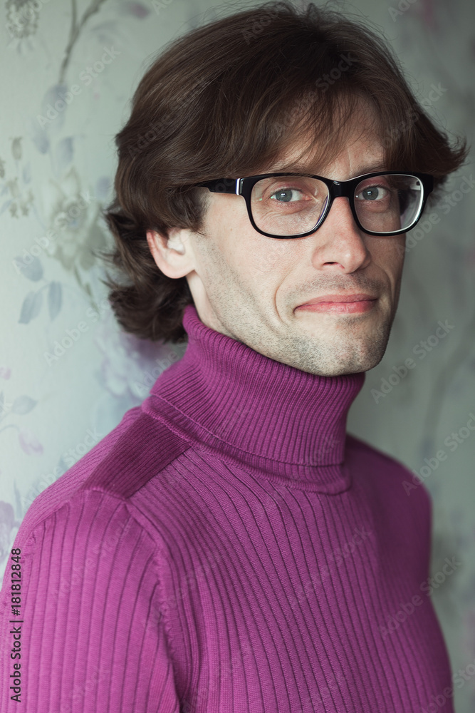 Stylish teacher, lecturer concept. Portrait of smiling young handsome man wearing eyeglasses over vintage background. Trendy turtleneck. Perfect long glossy hair Stylish teacher, lecturer concept. Portrait of smiling young handsome man wearing eyeglasses over vintage background. Trendy turtleneck. Perfect long glossy hair