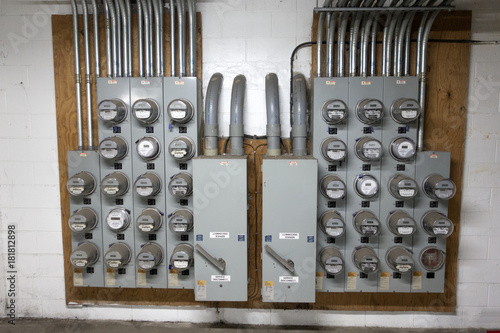 A gaggle of electric meters in the basement for an apartment building. St Paul Minnesota MN USA