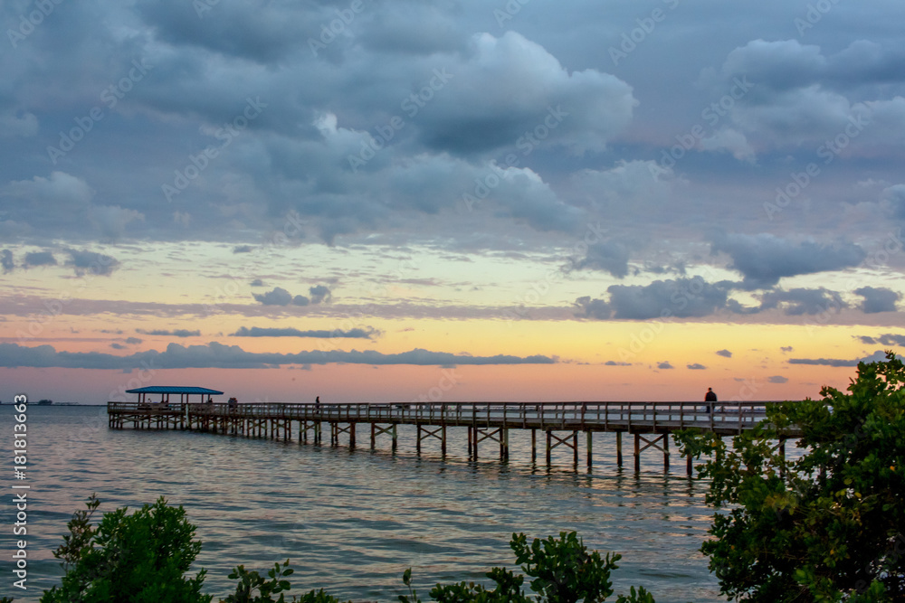 A silhouette of the  Safety Harbor pier on Tampa Bay in Florida during a purple sunset.