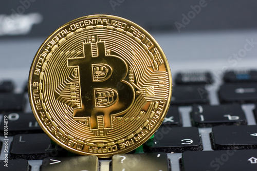 golden bitcoin coin on keyboard. New virtual money. Cryptocurrency. Business and Trading concept.