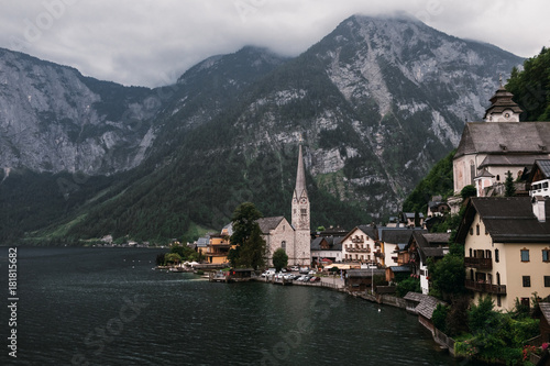 Scenic view of famous Hallstatt lakeside town reflecting in Hallstattersee lake in the Austrian Alps, Austria © Andrew Bayda