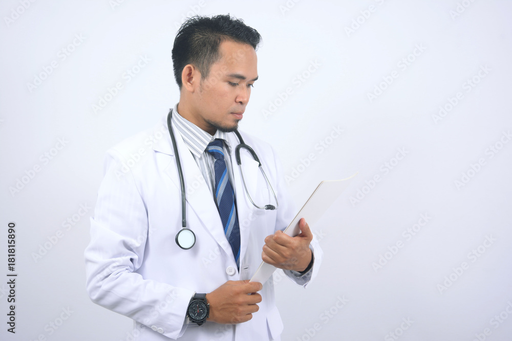 Young Asian medical doctor holding blank paper Young Asian medical doctor holding blank paper