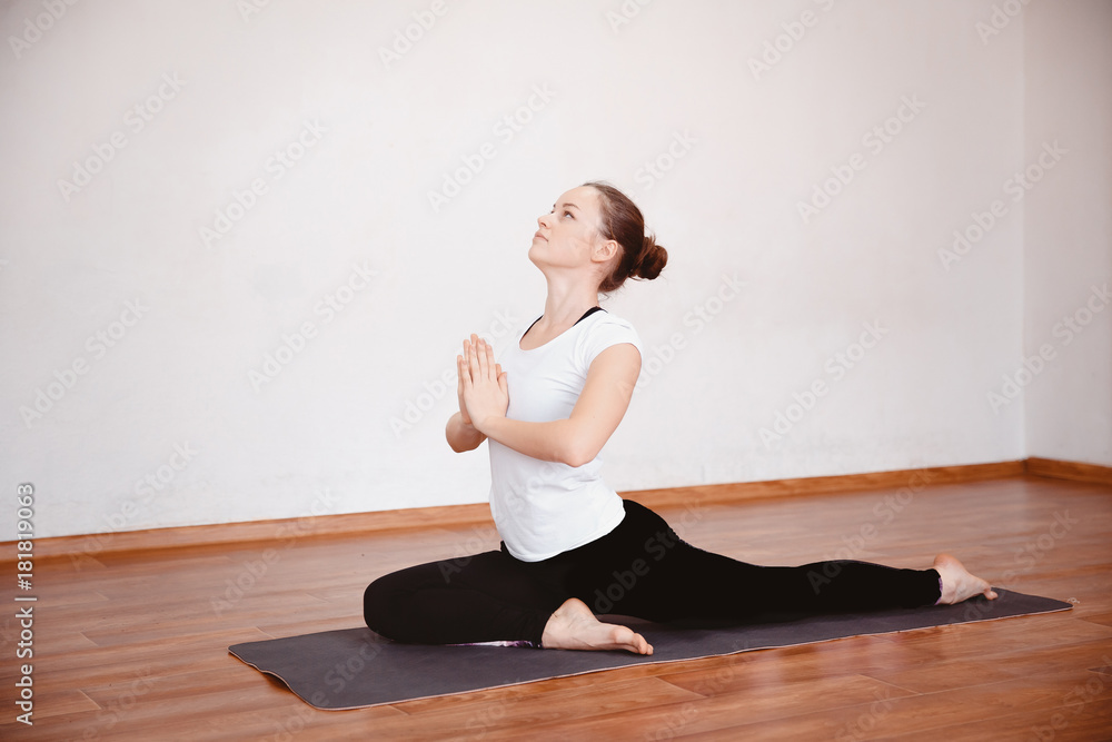 Yoga Concept. Close up woman meditates while practicing yoga in training hall or home. Yoga Concept. Close up woman meditates while practicing yoga in training hall or home.
