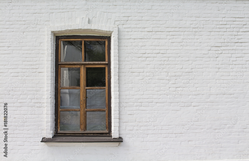 Wooden window on white wall