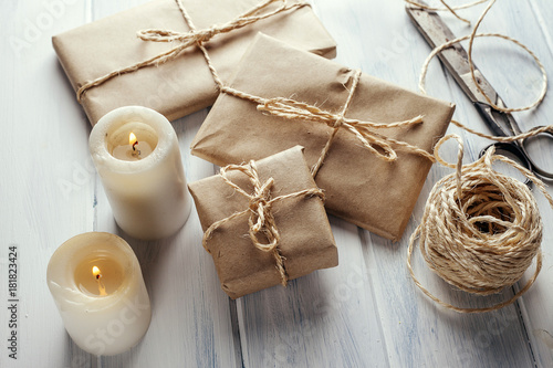 Packs wrapped in kraft paper and candles.