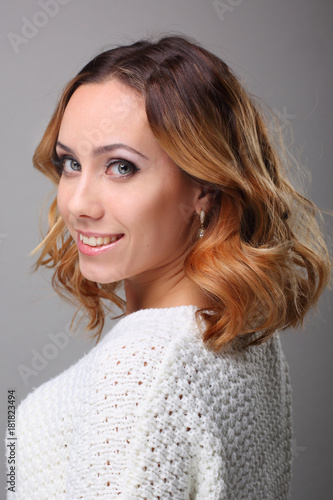 portrait of young woman with curly hair and wedding makeup