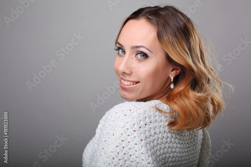 portrait of young woman with curly hair and wedding makeup