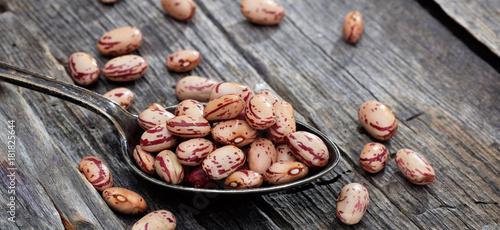 Pinto beans on an old wooden table