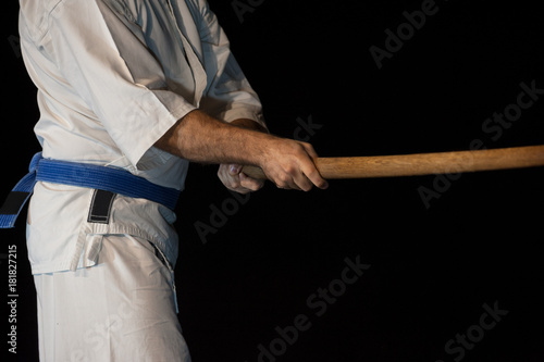 Blue belt aikido fighter in attack position