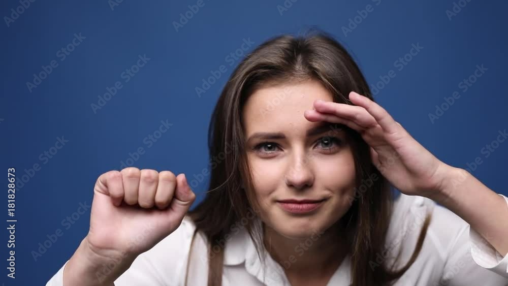 Young beautiful girl knocking at camera