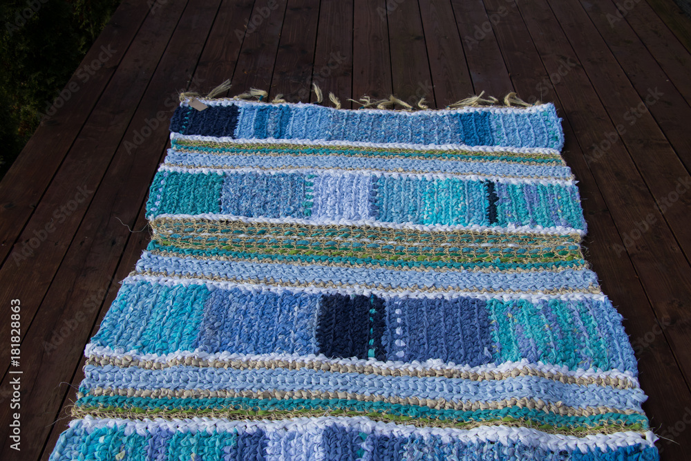Hand-knitted colorful carpet made of recycled materials Hand-knitted colorful carpet made of recycled materials