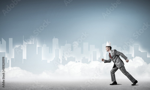 King businessman in elegant suit running and blue cityscape silh