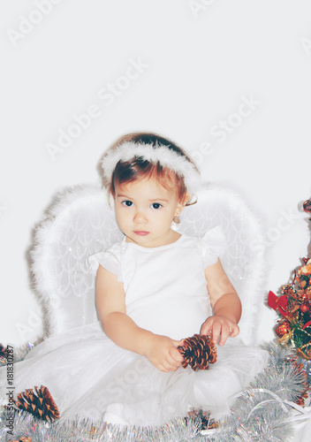 little child in the costume of an angel. Selective focus.   photo