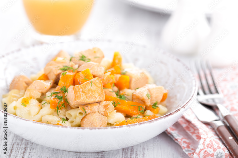 Braised chicken meat with carrot in sauce and pasta Braised chicken meat with carrot in sauce and pasta