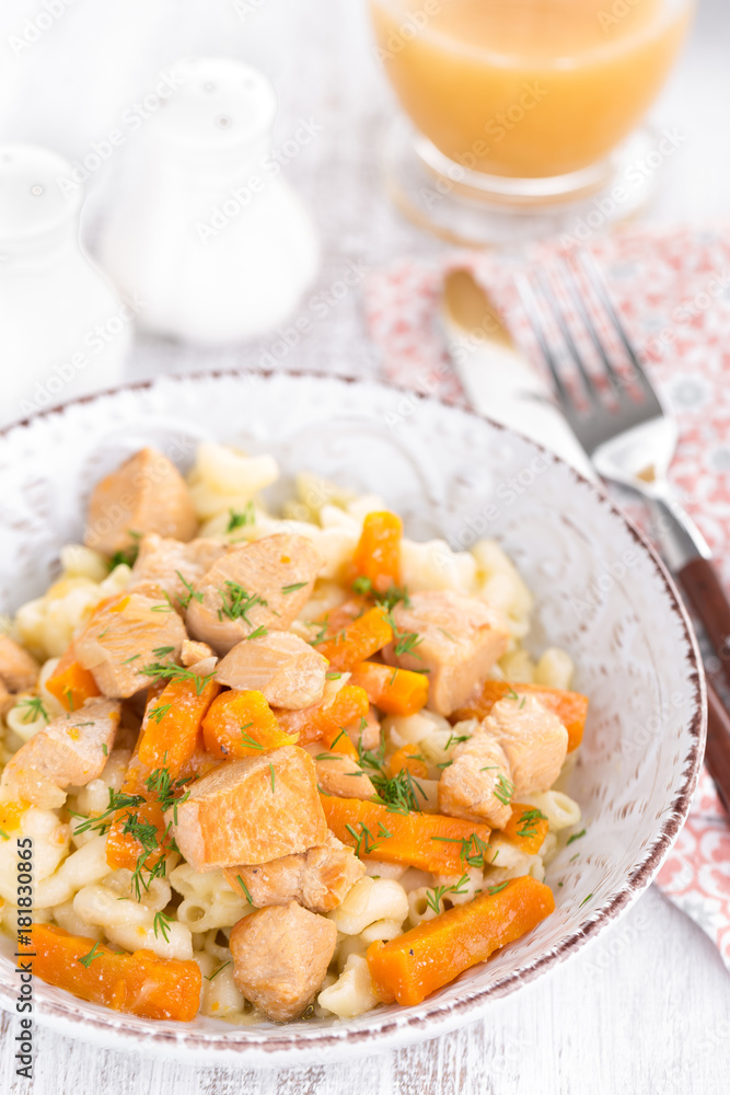 Braised chicken meat with carrot in sauce and pasta Braised chicken meat with carrot in sauce and pasta