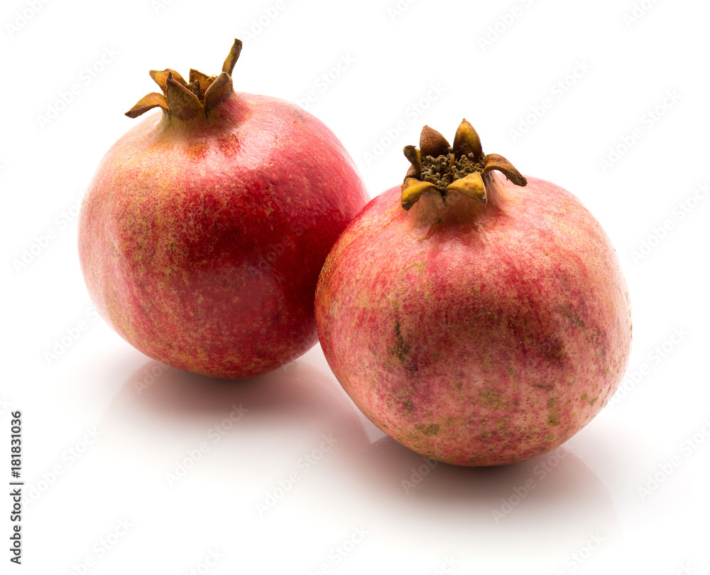 Two pomegranate isolated on white background. Two pomegranate isolated on white background.