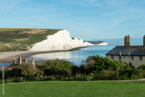 The Coast Guard Cottages & Seven Sisters Chalk Cliffs just outside Eastbourne, Sussex, England, UK photo