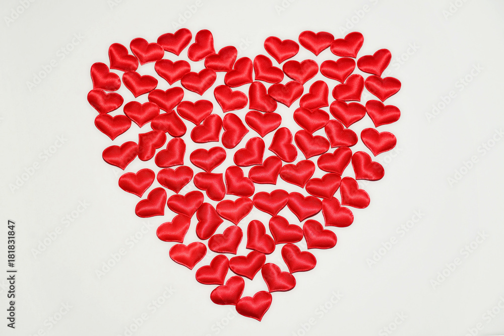Red decorative hearts on a white background in the shape of a heart Red decorative hearts on a white background in the shape of a heart