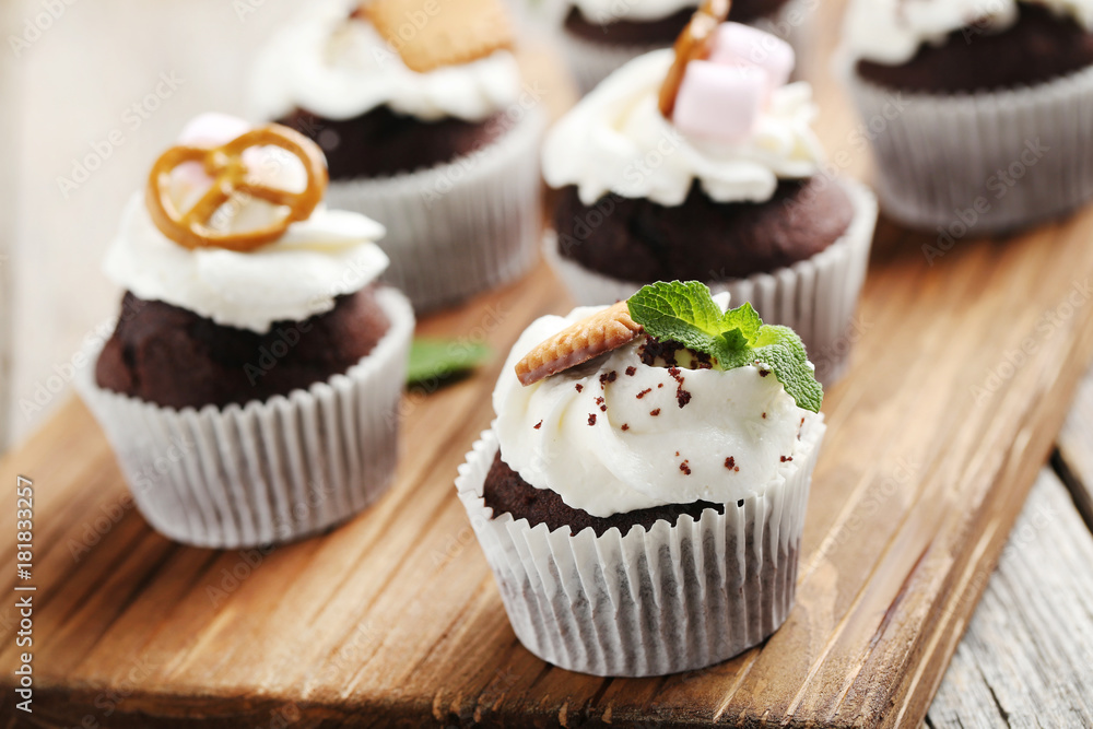 Chocolate cupcakes on a grey wooden table Chocolate cupcakes on a grey wooden table