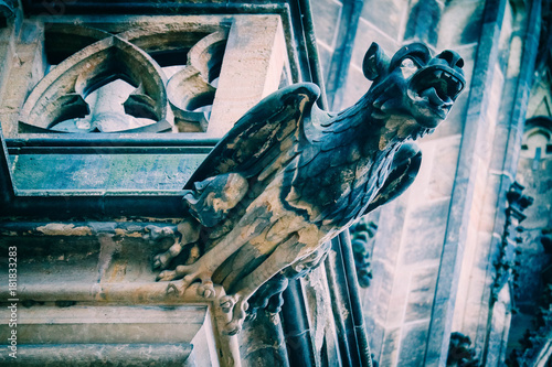 Fototapeta Czech architecture, scary gargoyle sculpture, gothic temple decoration