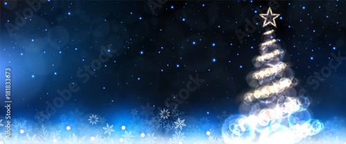 glowing christmas tree on frosty background