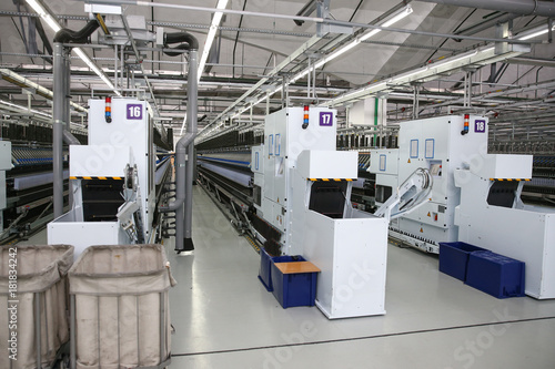 Factory production of cloth. Production line of thread