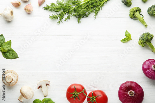 Frame of variety vegetables on white wooden table