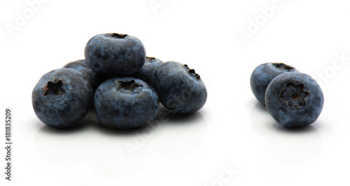 Bog blueberries isolated on white background fresh heap.