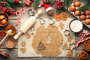 Baking christmas cookies on grey wooden table
