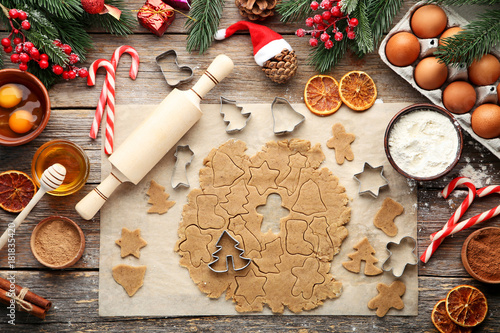 Baking christmas cookies on grey wooden table