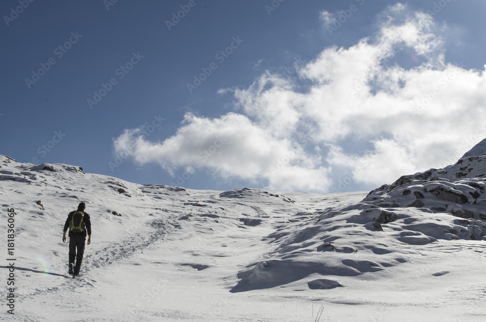 Boy hiking no a snowy trail