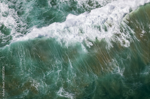 Aerial view of a wave at a beach