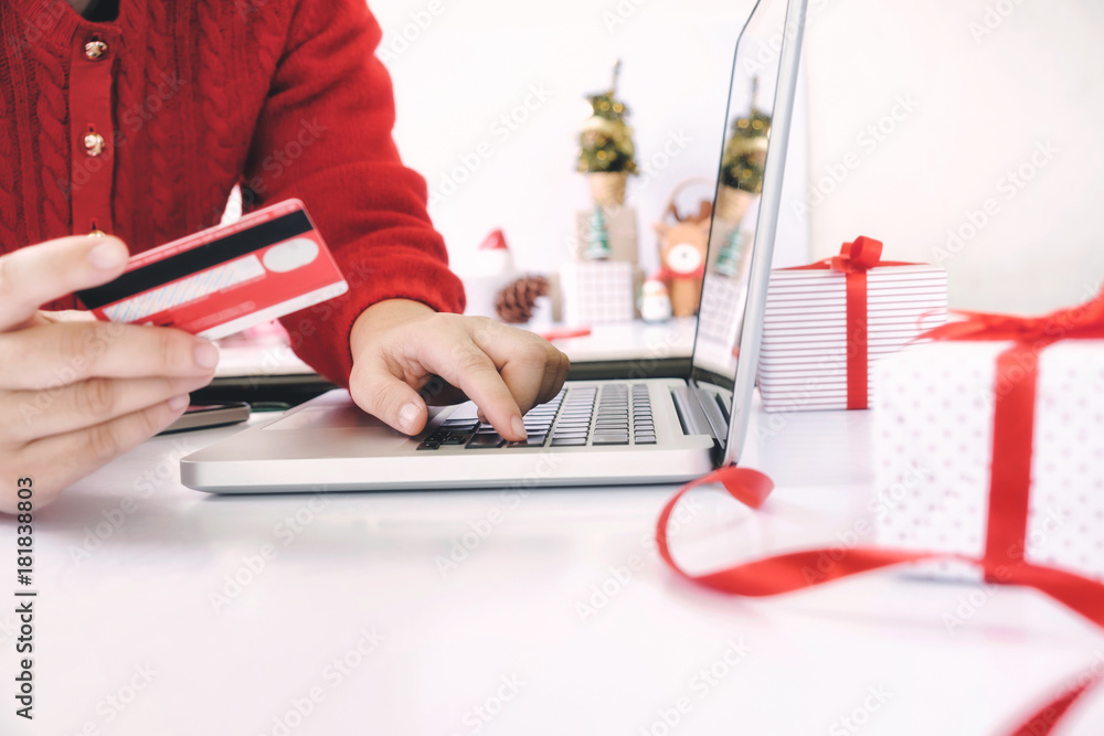 Woman holding credit card and shopping online. Woman holding credit card and shopping online.