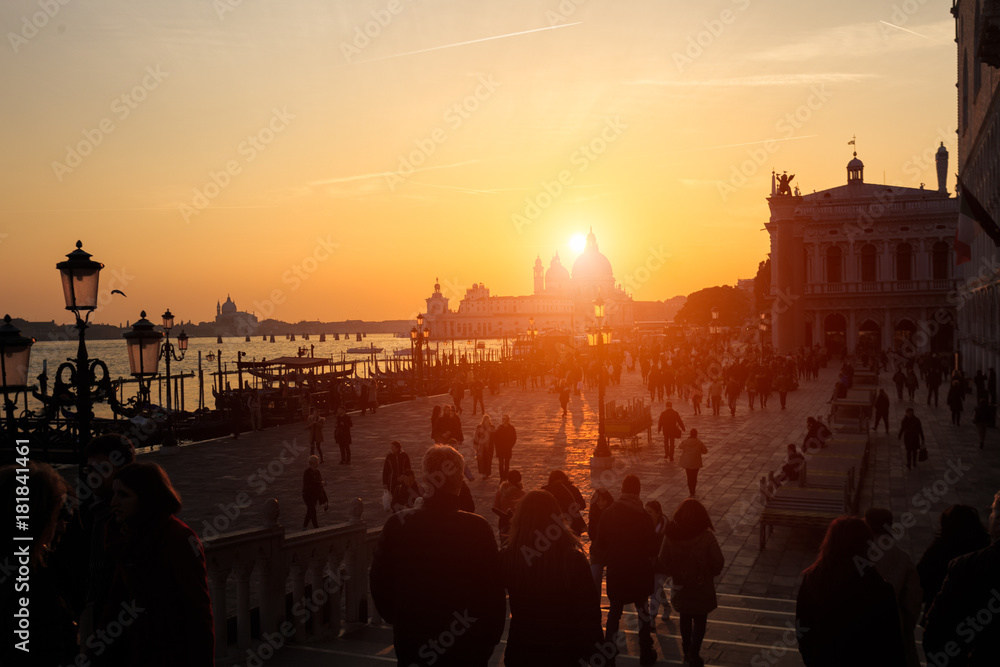 Sunset over the basilica of Santa Maria de la Salutte with the gondola in the foreground, Venice, Italy