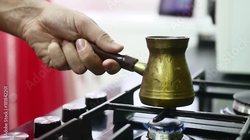 Wallpaper Mural Making turkish coffee in copper cezve over gas stove. Milling of grains. On the gas stove Turk with a running coffee. Running coffee close up. gas stove with burning fire. A cup of coffee. Torontodigital.ca