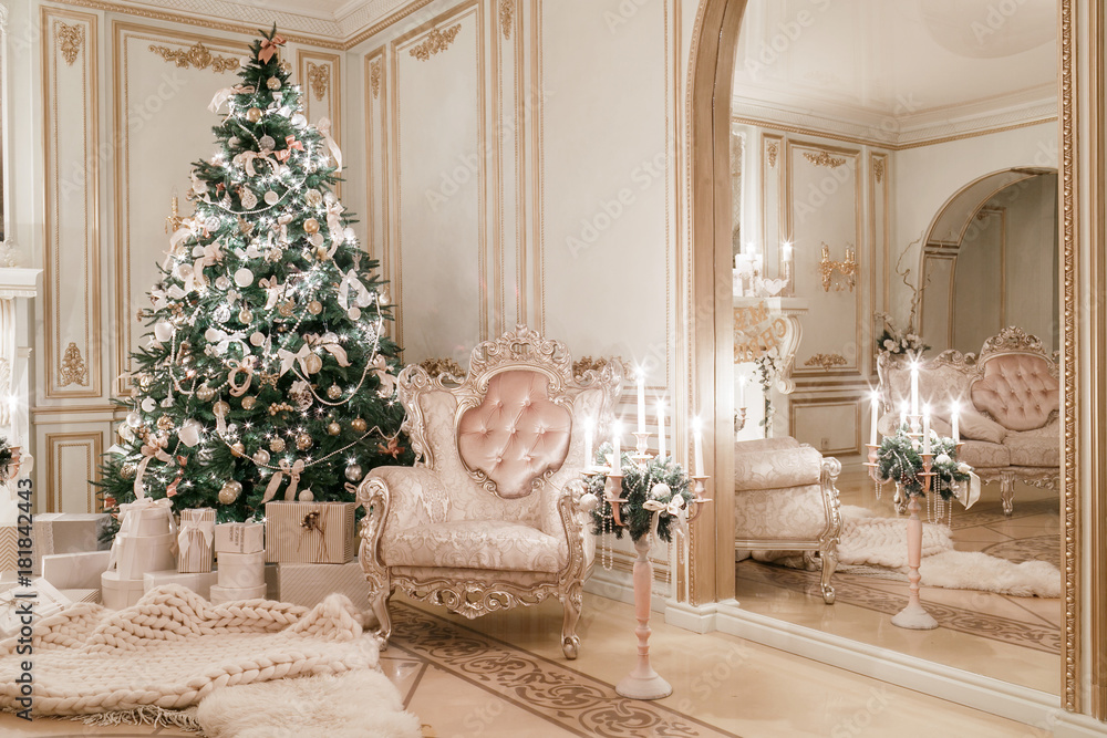 Christmas evening. classic apartments with a white fireplace.