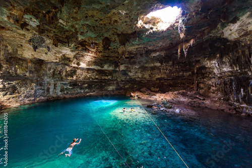 Cenote Samula Dzitnup near Valladolid, Yucatan, Mexico - swimming in crystal blue water photo