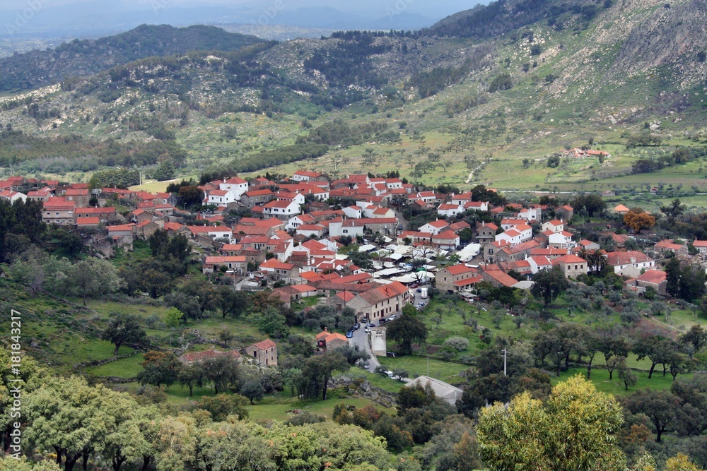 Top view of a Portuguese historic village. Houses surrounded by mountains and green vegetation.