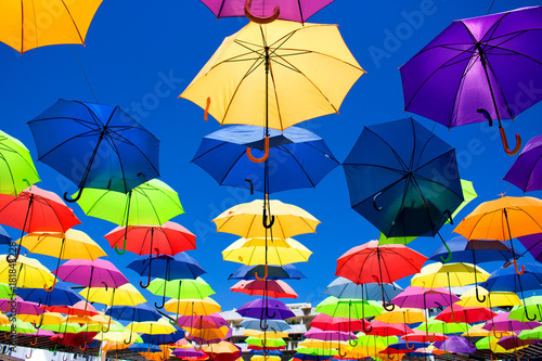 Multicolor umbrellas. Street art. Puerto Banus city, Marbella, Andalusia, Spain.