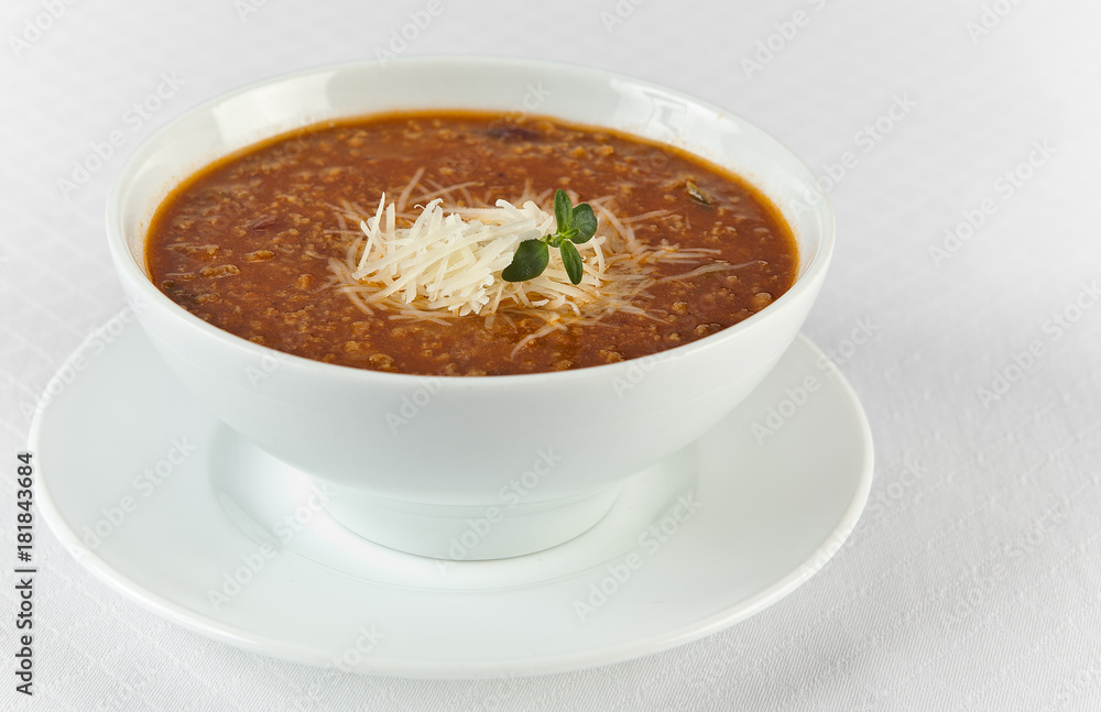 hot and spicy beef soup with cheese in a bowl hot and spicy beef soup with cheese in a bowl